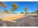 Landscaped backyard with a large grassy area at 3937 Jackpot Cir, Las Vegas, NV 89110