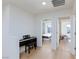 Hallway with hardwood floors and doorways to bedrooms at 4066 Painted Lady Ave, Las Vegas, NV 89141