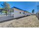 Side view of a single-story home with a carport and a large, fenced backyard at 501 Alexander Ave, Las Vegas, NV 89106