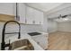 Kitchen features white shaker cabinets, marble countertops, and black faucet at 501 Alexander Ave, Las Vegas, NV 89106