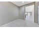 View down a hallway showcasing neutral walls and tile floors at 5020 Pioneer Scout St, North Las Vegas, NV 89031