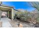 Landscaped side yard with covered walkway and shed at 5020 Pioneer Scout St, North Las Vegas, NV 89031