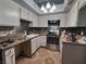 Kitchen with stainless steel appliances and updated backsplash at 5409 Centurion Ct # 104, Las Vegas, NV 89122