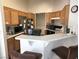 Kitchen with oak cabinets, white countertops, and stainless steel appliances at 6409 Sierra Diablo Ave, Las Vegas, NV 89130