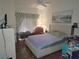 Main bedroom with tiled floors, a ceiling fan, and neutral-toned bedding at 6409 Sierra Diablo Ave, Las Vegas, NV 89130