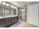 Modern bathroom with double sinks and a shower at 6482 Twin Harbors Ct, Las Vegas, NV 89141