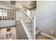 White railing staircase leading to upper level with view to lower level bathroom at 6482 Twin Harbors Ct, Las Vegas, NV 89141