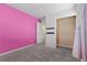 Pink bedroom with gray carpet and a closet at 6648 Weeping Pine St, Las Vegas, NV 89149