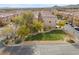 An aerial view of townhouses and a landscaped common area at 6648 Weeping Pine St, Las Vegas, NV 89149