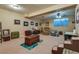 Finished basement recreation room, featuring a carpeted floor and ample space for relaxation at 7320 Bath Dr, Las Vegas, NV 89131