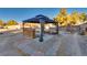 Relaxing gazebo with stone patio and built-in bar at 7320 Bath Dr, Las Vegas, NV 89131