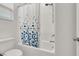 Clean bathroom with tiled shower, white fixtures, and shower curtain at 10116 Skye Castle Dr, Las Vegas, NV 89166