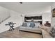 Living room with wood-look flooring, a staircase, and an open layout leading to the kitchen and dining area at 10116 Skye Castle Dr, Las Vegas, NV 89166