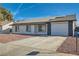 Updated single-story home with solar panels and a paved driveway at 136 Marion Dr, Las Vegas, NV 89110