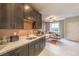 Modern kitchenette with dark wood cabinets and white countertops at 1922 Molly Brook Dr # Lot 6, North Las Vegas, NV 89084