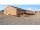 Tan house exterior with gravel driveway and desert landscape at 2270 Gally Rd, Pahrump, NV 89060