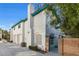 Exterior view of a two-story home with a teal-accented facade, attached garage, and gated entry at 2725 Stars End St, Las Vegas, NV 89108