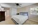 Bedroom with ceiling fan, carpeted floors, a large bed, and walk-in closet at 3138 Laurel Ave, Henderson, NV 89014