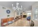 Dining area with chandelier, fireplace, and views of the living room at 3138 Laurel Ave, Henderson, NV 89014