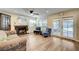 Inviting living room with a fireplace, wood-look flooring, and access to the backyard at 3138 Laurel Ave, Henderson, NV 89014