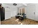 Entryway with wood-look tile floors, a refrigerator, and a door leading to the backyard at 320 Brookside Ln # C, Las Vegas, NV 89107