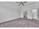 Large bedroom with carpet and access to bathroom at 4828 Storm Mountain St, Las Vegas, NV 89130