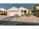 Charming single-story home with a two-car garage and landscaped front yard at 488 Eagle Vista Dr, Henderson, NV 89012