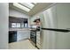 Compact kitchen featuring stainless steel appliances and ample counter space at 488 Eagle Vista Dr, Henderson, NV 89012