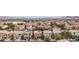 Aerial view of homes in a desert community with mountain backdrop at 499 Warminster Ave, Las Vegas, NV 89178