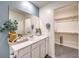 Well-appointed bathroom featuring a single vanity, walk-in shower, and walk-in closet at 4997 Apple Mesa Ave # Lot 219, Las Vegas, NV 89139