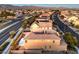 Aerial view of house with backyard patio at sunset at 5833 Addy Ln, North Las Vegas, NV 89081