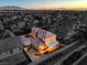 Aerial view of a two-story house with a covered patio at sunset at 5833 Addy Ln, North Las Vegas, NV 89081