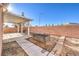 Covered patio with concrete flooring and fire pit at 5833 Addy Ln, North Las Vegas, NV 89081