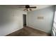 Empty bedroom with carpeted floors, ceiling fan, and two windows at 6213 Pangea Ave, Las Vegas, NV 89139