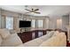 Inviting living room with wood floors, ceiling fan, and ample natural light at 9469 Alma Ridge Ave, Las Vegas, NV 89178