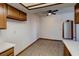 Spacious dining area with wood-look flooring, ceiling fan, and access to the kitchen at 1402 Santa Margarita St # H, Las Vegas, NV 89146