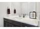 Modern bathroom with dark vanity and white countertop at 144 Juliette Pointe Ln, Henderson, NV 89011