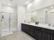 Modern bathroom with walk-in shower and double vanity at 144 Juliette Pointe Ln, Henderson, NV 89011