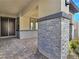 Covered entryway with brick columns and a paved walkway at 144 Juliette Pointe Ln, Henderson, NV 89011