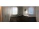 Bright bedroom with dark wood-like flooring and several windows at 158 Copper St, Henderson, NV 89015