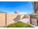 Small backyard with a white deck and artificial turf at 228 Yardarm Way, Las Vegas, NV 89145