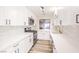 Modern kitchen with white shaker cabinets and quartz countertops at 228 Yardarm Way, Las Vegas, NV 89145