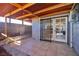 Covered back patio area with tiled flooring, perfect for outdoor relaxation at 2472 Paradise Village Way, Las Vegas, NV 89120