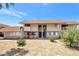 Front view of a two-story condo building with landscaping and shrubs at 2520 Paradise Village Way, Las Vegas, NV 89120