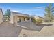 Covered patio with gravel landscaping, perfect for relaxing at 2604 Mourning Warbler Ave, North Las Vegas, NV 89084