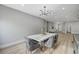 Dining room featuring a stylish table, chairs, and modern chandelier at 2895 Sunlit Glade Ave, Henderson, NV 89074