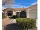 Single-story home with attractive landscaping and a two-car garage at 3020 Ripon Dr, Las Vegas, NV 89134