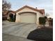 Two-car garage with an attached single-story home at 3020 Ripon Dr, Las Vegas, NV 89134