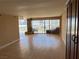 Spacious living room with hardwood floors, fireplace, and large windows at 3111 Bel Air Dr # 24E, Las Vegas, NV 89109