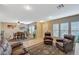 Spacious living room with brown leather furniture at 3181 Mist Effect Ave, Henderson, NV 89044